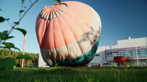 Hot air balloon launch on the summer lawn Stock Footage 265784310
