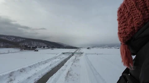 Hot Air Balloon Passenger Perspective over Furano Snowy Landscape Видео 334454542