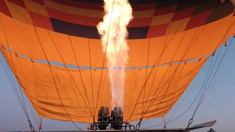 Hot air balloon preparing for flight with propane gas heat in Cappadocia Turkey. Stock Footage 131241590