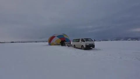 Hot Air Balloon Setup on Snow Covered Field in Furano Japan Stock Footage 334454615