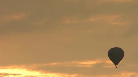 Hot air balloon with sunset Stock Footage 79016575