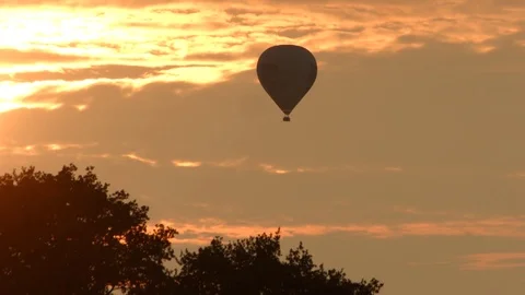 Hot air balloon with sunset Stock Footage 79016594