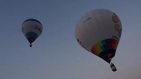Hot air balloon taking off in early morning Stock Footage