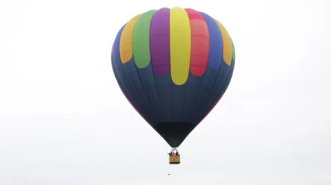 Hot Air Balloon taking off on plain white background Stock Footage 64822009