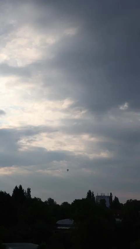 Hot air balloon under evening clouds Stock Footage 340134913