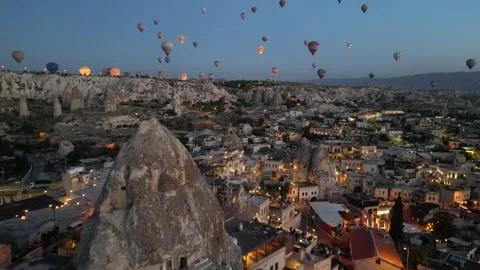 Hot air balloons ascend over Cappadocia's unique landscape Stock Footage 321153573
