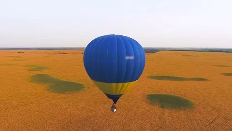 Hot air balloons floating low over fields, pilots training, educational program Stock Footage 81269499
