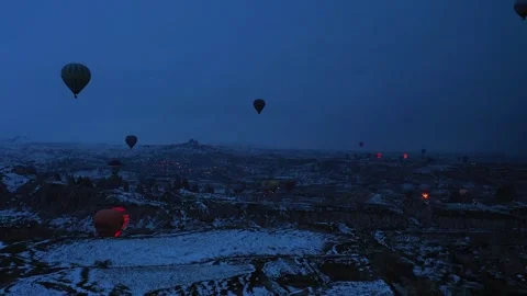 Hot Air Balloons Floating Over Snowy Landscape at Dusk Video stock 344353288