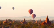 Hot Air Balloons Fly Over Ancient Temples Of Bagan Historical Site In Myanmar Stock Footage