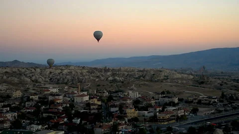 Hot air balloons flying over Goreme at sunrise. Cappadocia. Turkey Stock Footage 86204652