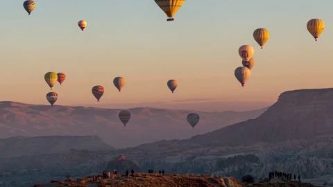 Hot air balloons flying over the valley at Cappadocia, Turkey. Video stock 201736737