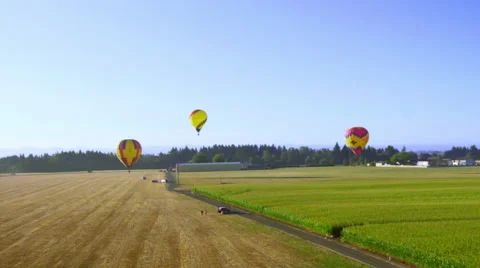 Hot air balloons getting ready to land Stock Footage 56689830