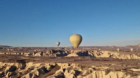 Hot air balloons gracefully dance through the mystical landscapes of Cappadocia. Stock Footage 263244699