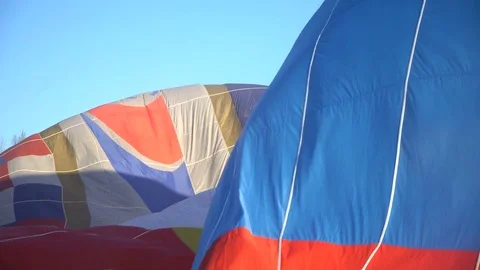 Hot air balloons preparing for flight. inflate a balloon. Stock Footage