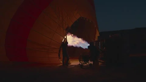 Hot air balloons preparing for takeoff and flying in Cappadocia Stock Footage 262561920