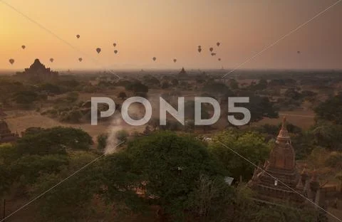 Hot air balloons at sunrise above Bagan (Pagan), Myanmar (Burma), Asia Stock Photos