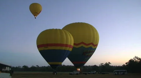 Hot Air Balloons Taking Off at Dawn Stock Footage