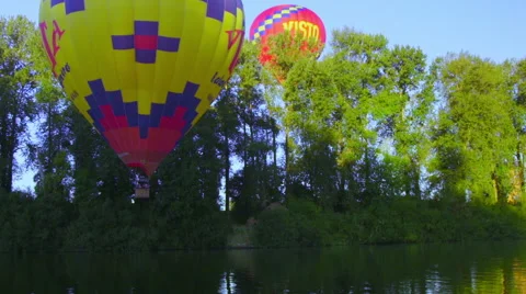 Hot air balloons by trees Stock Footage 56580472