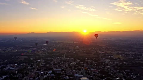 Hot air balloons while the sun is rising Stock Footage 265802257
