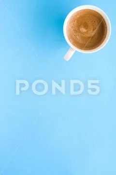 Hot aromatic coffee on blue background, flatlay Stock Photos