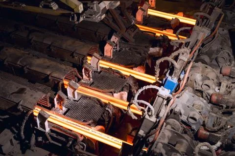 Hot billet bloom continuous casting, also called strand casting. Stock Photos