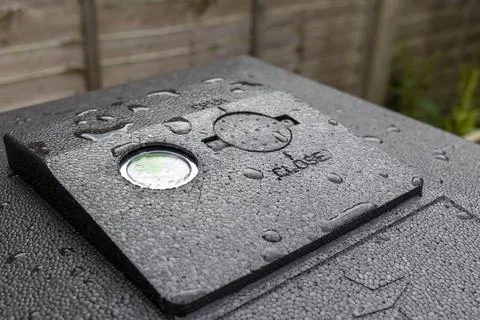 Hot bin compost bin lid temperature gauge and vent urban backyard organic garden Stock Photos