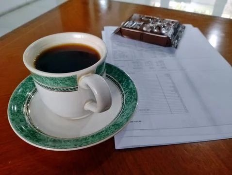Hot Black Coffee Cup on Work Desk with Laptop and Notebook Office Stock Photos