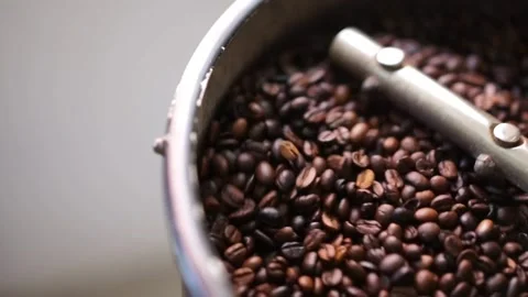 Hot black roasted coffee bean in machine cooling roastery machine industria.. Stock Footage 272456486