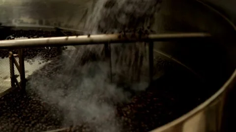 Hot black roasted coffee bean in machine cooling roastery machine industria.. Stock Footage 272457699