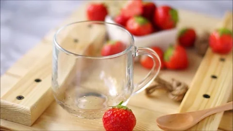 Hot black tea with strawberries Stock Footage 130264806