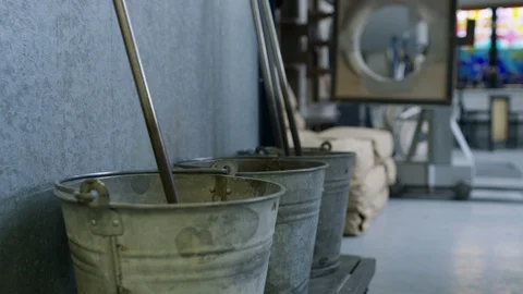 Hot blowpipe being put in bucket for cooling Video stock 107934053
