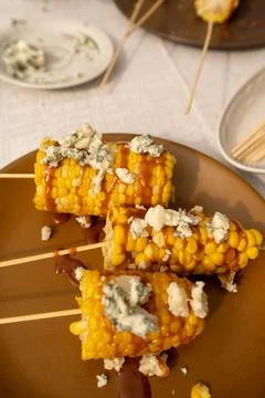 Hot boiled corn with bright yellow grains with Homemade salted caramel sauce and Stock Photos