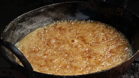 Hot Boiling Dark Brown Sugar Sweet Sugar And Jaggery Syrup Called Gud Chasni Stock Footage 166179239