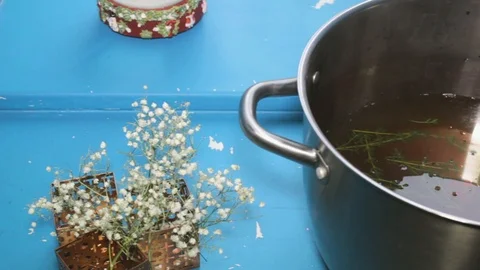 Hot boiling liquid soup close-up on blue background, close-up slider shot Stock Footage 101309175