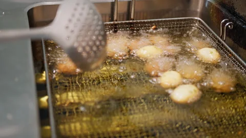 Hot Boiling Olive Oil For Some Traditional Italian Bites Stock Footage 288565735