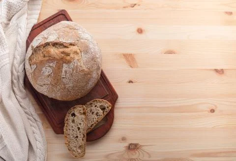 Hot bread on a table made of wood. 스톡 사진