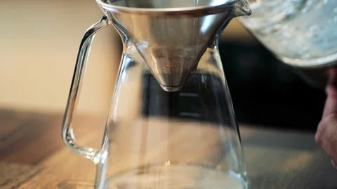 Hot brewed coffee dripping from filter into glass pot, Drip coffee, making of Stock Footage 155382334