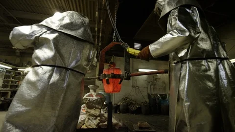 Hot bronze being poured in foundry Stock Footage 105849277