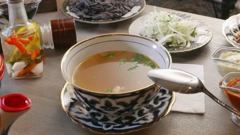 Hot broth in an asian cup Stock Footage 165529530