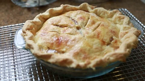 Hot bubbling apple pie from oven Stock Footage 43395074