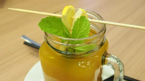 Hot buckthorn drink with mint leaf and fruit slices Video stock 144306607