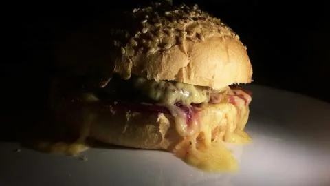 Hot burger on a plate. Stock Photos