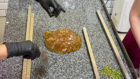 Hot Candy Syrup Pouring Onto Granite Surface 스톡 동영상 342515312