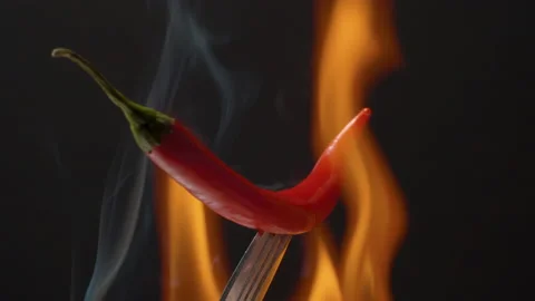 Hot chili in fire Stock Footage 145674361