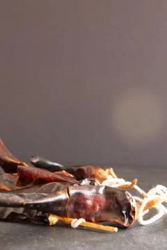 Hot chilli pepper on black background with rustic cloth, vintage tablecloth.  Stock Photos