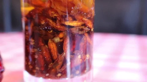 Hot chilly pepers in jar Stock Footage 101438634