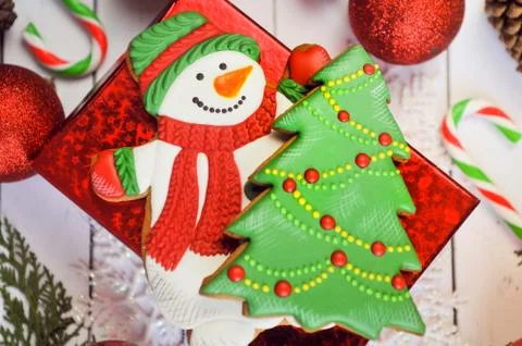 Hot chocolate cup with marshmallow, gingerbread snowman and christmas gift on Stock Photos
