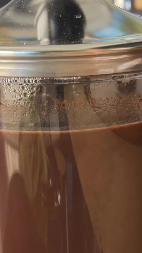 Hot chocolate dispenser Serving steamy hot coffee out of a percolator. Stock Footage 302000460