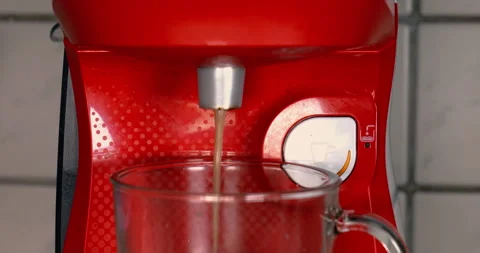 Hot chocolate flowing from a machine. make hot chocolate at home Video stock 267244311
