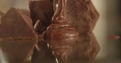 Hot chocolate spreads on a mirror surface Stock Footage 198561472